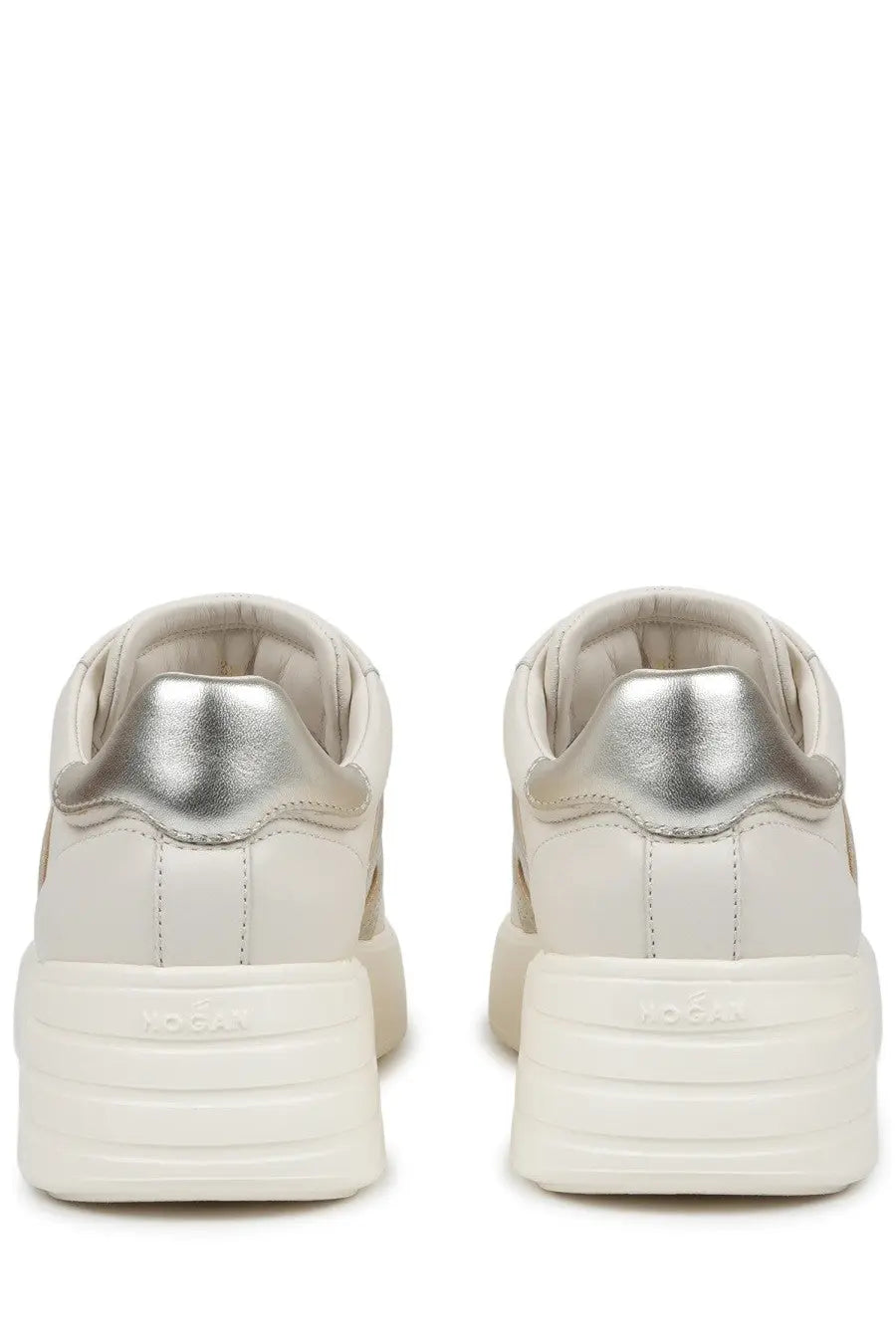 Cream-colored hogan women’s sneaker rebel beige with metallic silver heel tab and chunky white rubber sole back view