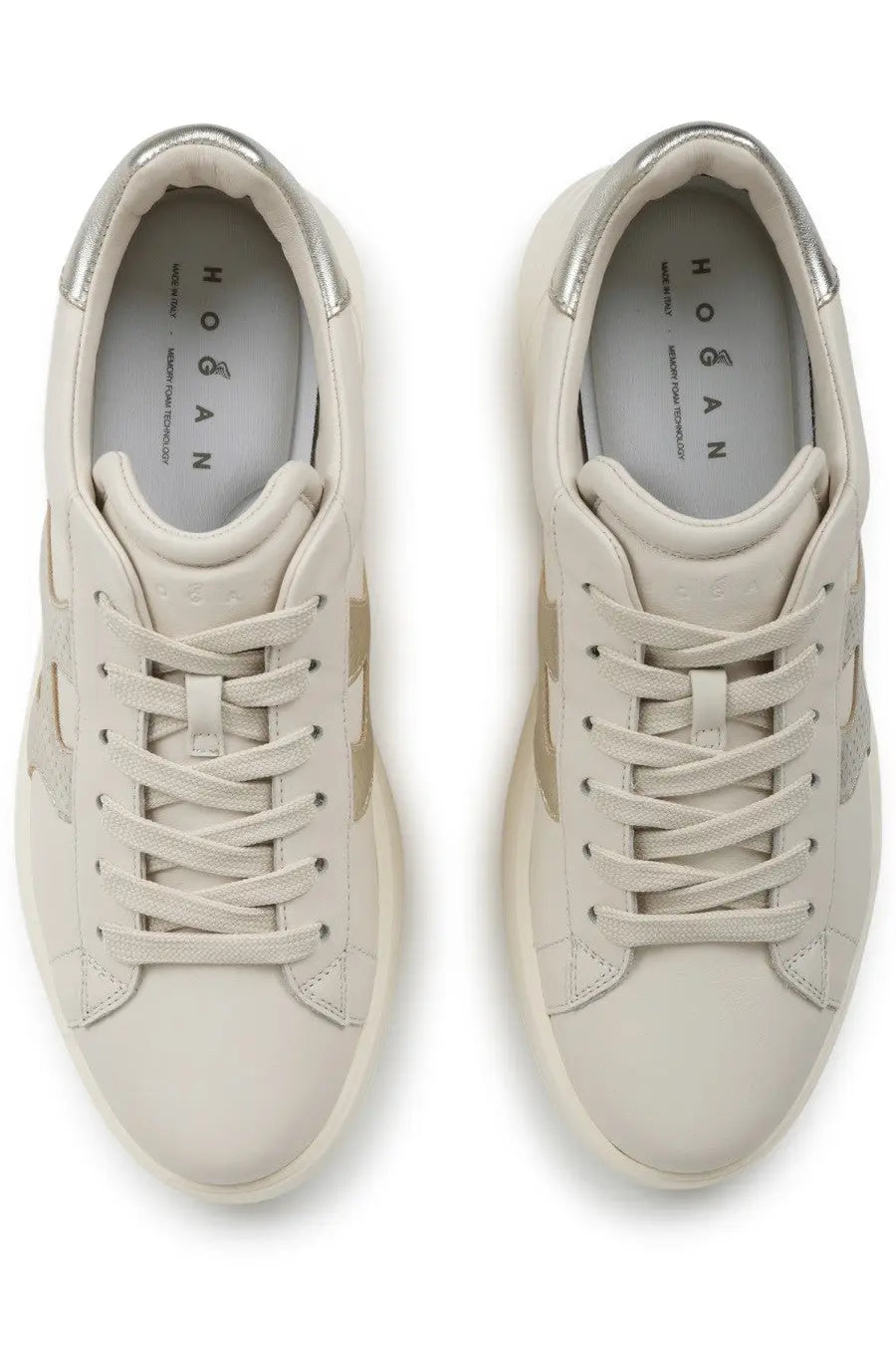 Cream-colored hogan women’s sneaker rebel beige with metallic silver accents on heel and side panels