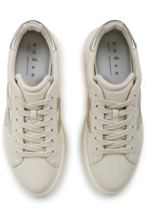 Cream-colored hogan women’s sneaker rebel beige with metallic silver accents on heel and side panels