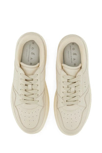 Cream-colored suede hogan women’s sneaker with minimalist design and perforated toe box from hogan skyscraper white collection