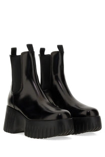 Hogan women’s stripe chelsea boot black with black patent leather and chunky ribbed platform sole