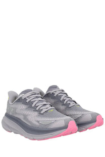Gray and pink hoka unisex clifton gtx sneaker with breathable mesh upper and cushioned sole for running