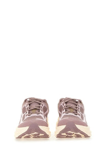 Pair of taupe and cream-colored hoka one one unisex clifton ONE9 running shoes with mesh uppers and chunky soles