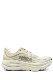 Beige hoka one bondi green unisex sneaker with breathable mesh upper and thick cushioned sole for running