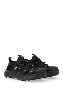Black hoka unisex sneaker hopara sandal with textured mesh upper and rugged rubber sole for outdoor use
