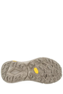 Tan rubber outsole with aggressive tread and yellow vibram logo on hoka unisex sneaker mafate speed lite beige