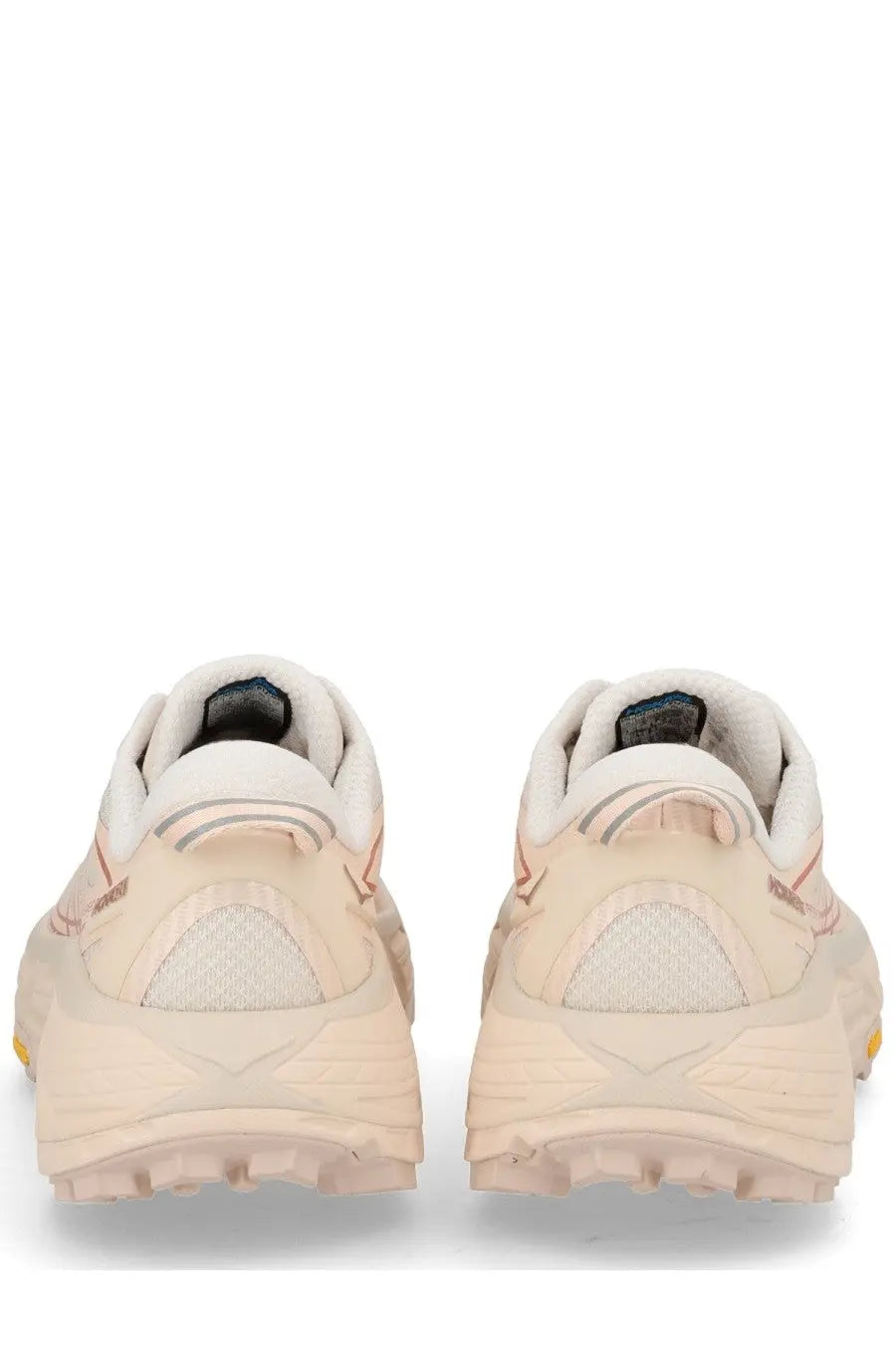 Cream-colored hoka one one mafate speed pink unisex sneaker with textured layered design and pink accent stitching