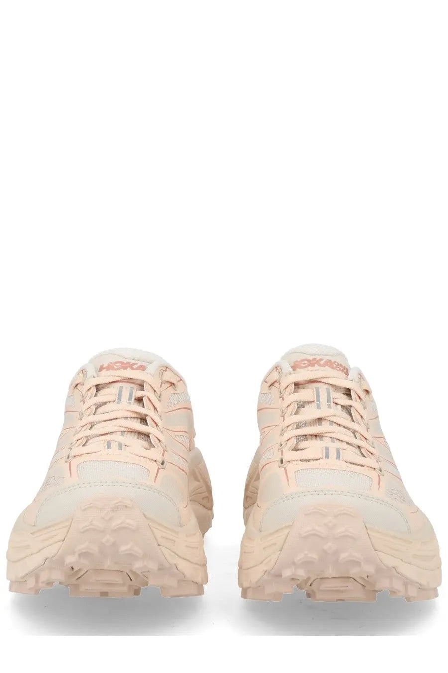 Pair of beige Hoka One One unisex Mafate Speed running shoes with textured soles and matching laces