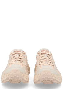 Pair of beige Hoka One One unisex Mafate Speed running shoes with textured soles and matching laces