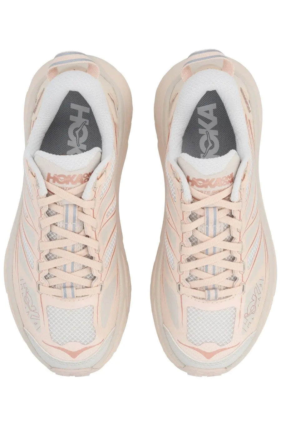 Pair of Hoka Unisex sneaker Mafate Speed pink running shoes in soft blush pink and white mesh with textured rubber soles