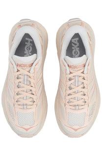Pair of Hoka Unisex sneaker Mafate Speed pink running shoes in soft blush pink and white mesh with textured rubber soles