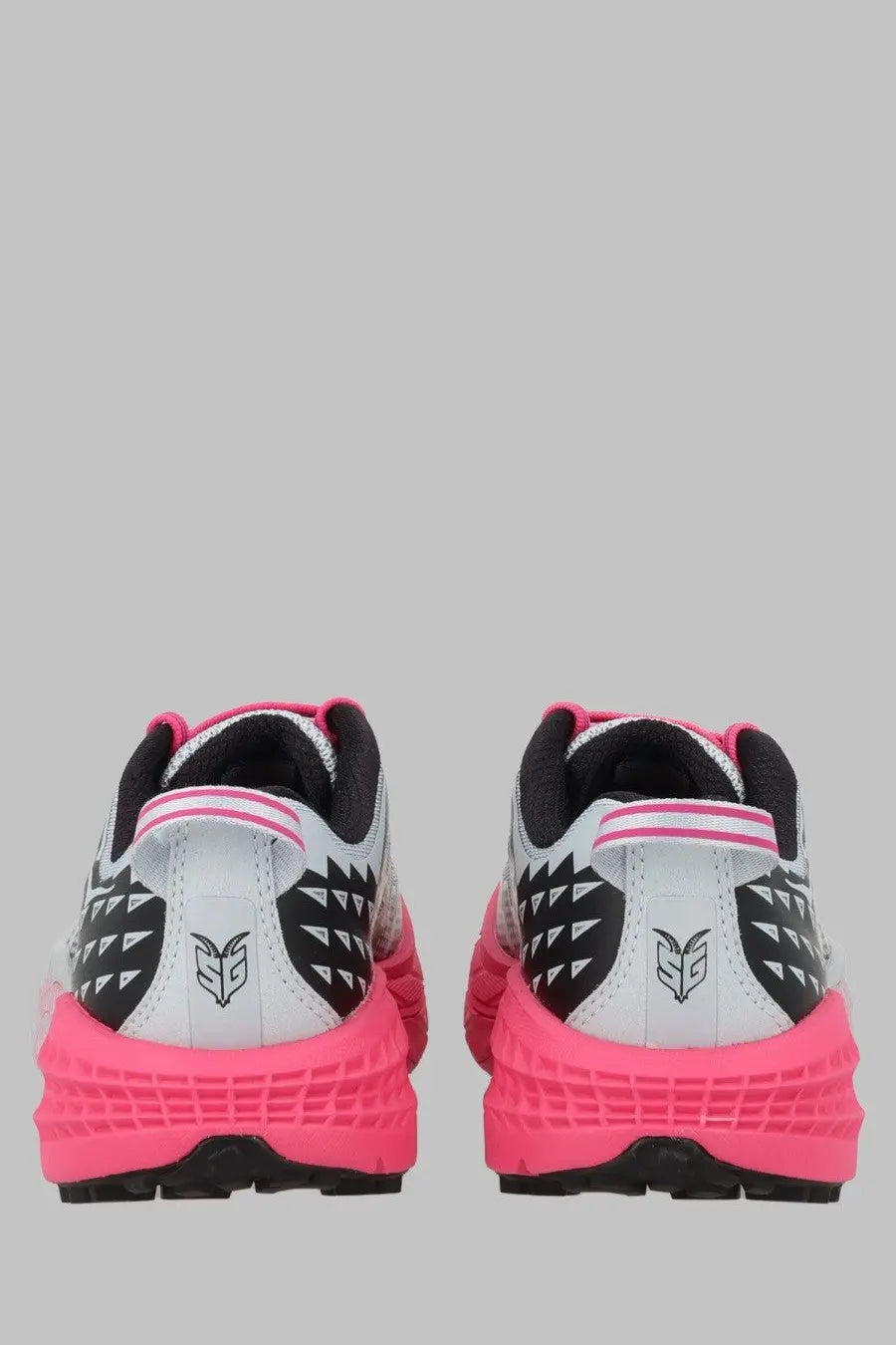 Bright pink and white hoka one one speedgoat unisex running shoes with black geometric heel patterns back view