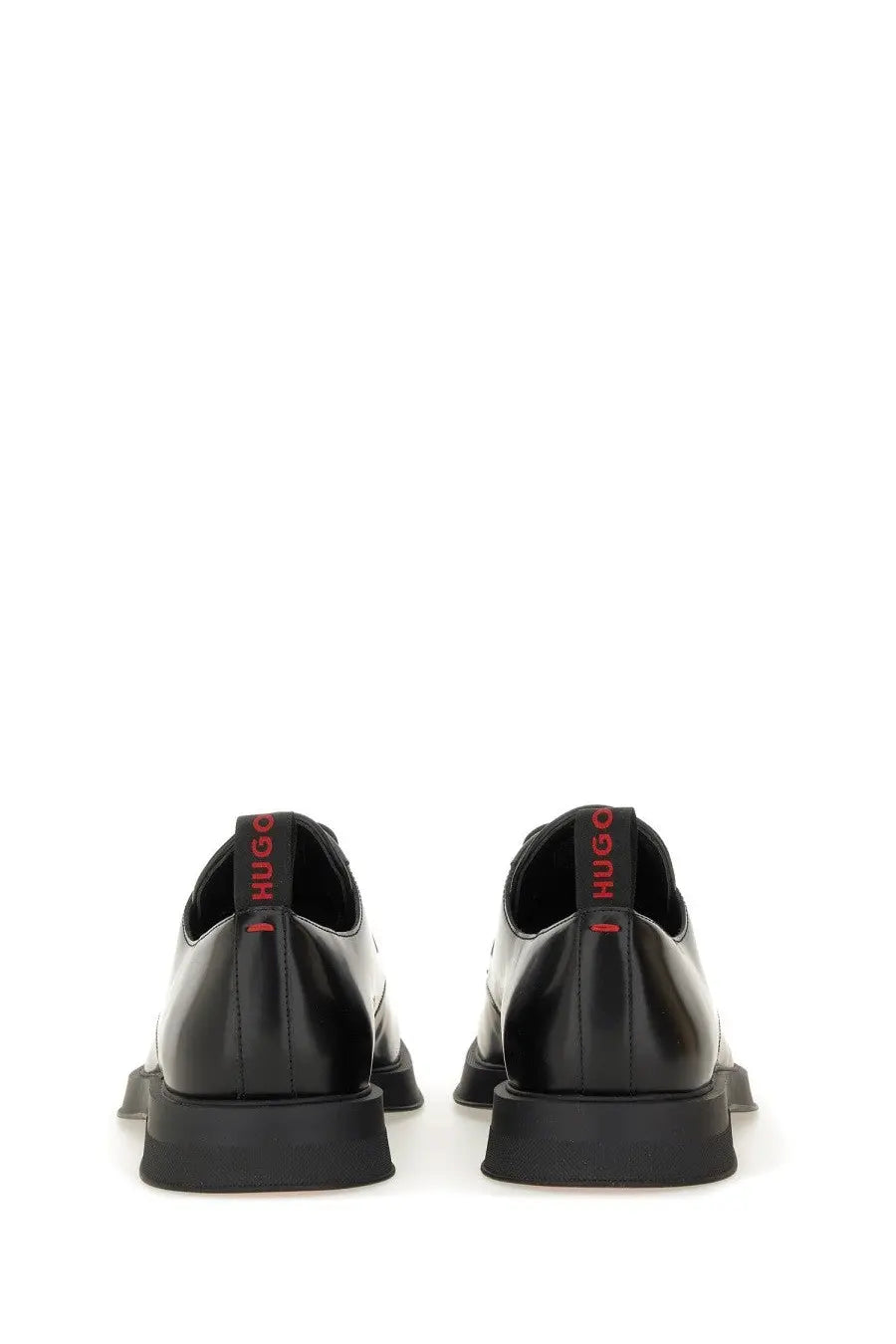 Black leather hugo boss men’s derby loafer showing back with red branding on the heel tab