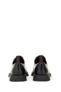 Black leather hugo boss men’s derby loafer showing back with red branding on the heel tab