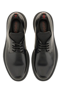 Hugo boss men’s black leather derby loafer with patent leather, chunky sole, lace-up design, and red insole branding