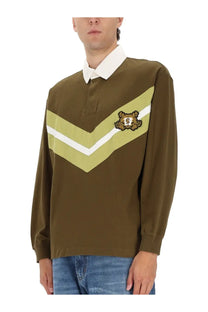 Hugo Boss men’s olive green long-sleeved rugby shirt with white collar and light green chevron stripes with crest patch