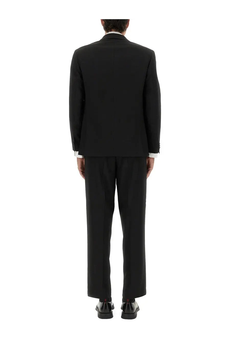 HUGO BOSS men’s slim fit black tailored suit with classic cut and white shirt cuffs visible at the wrists