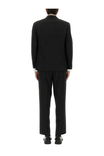 HUGO BOSS men’s slim fit black tailored suit with classic cut and white shirt cuffs visible at the wrists