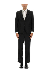 Hugo boss men’s slim fit black tailored suit with classic two-button design and matching trousers for formal wear
