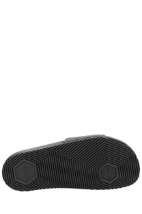 Black rubber sole of hugo boss men’s black slipper with hexagonal tread pattern and embossed brand logo