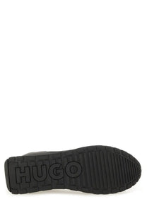 Black rubber sole with embossed hugo logo of hugo boss men’s sneaker black shown from the back side