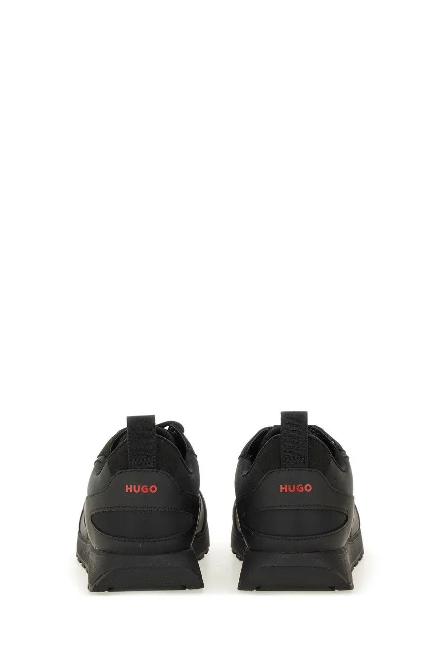 Back view of hugo boss men’s black leather sneakers with red branding on the heel for casual wear