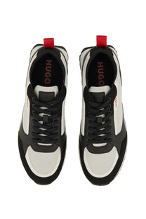 Back side of hugo boss men’s grey sneaker in black and white with red accent on heel tab made of mixed materials