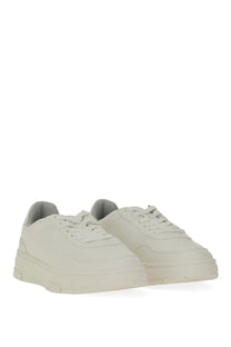 Hugo Boss men’s cream-colored suede sneakers with chunky sole and minimalist design in white