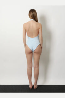 Light blue hunza g women’s adriana one-piece swimsuit with crinkle fabric halter neckline and open back shown from back