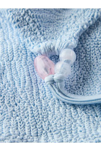 Hunza G women’s cassie the original crinkle bikini blue with a delicate light blue knitted drawstring bag and bead accent