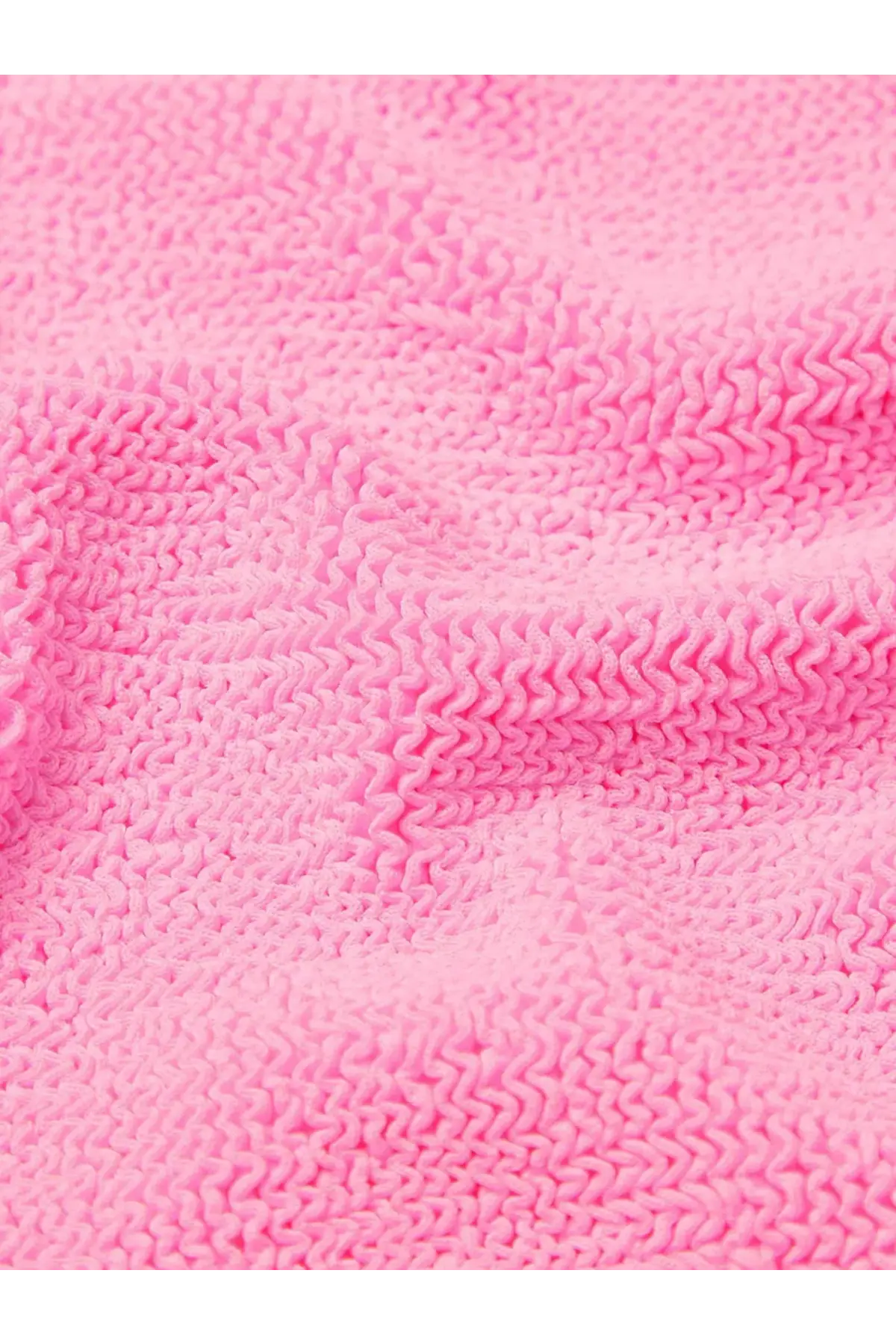 Hunza G women’s one piece swimsuit in bubblegum pink crinkle fabric with a soft textured wavy pattern