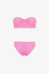 A vibrant pink textured knit two-piece bikini set with a strapless top and central bow detail by Hunza G