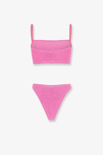 A vibrant pink knitted bikini set with thin straps and ribbed fabric from hunza g original crinkle bubblegum collection