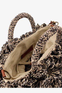 Ibeliv women’s coral raffia crossbody bag with handwoven black and beige rope handles and fringed detailing