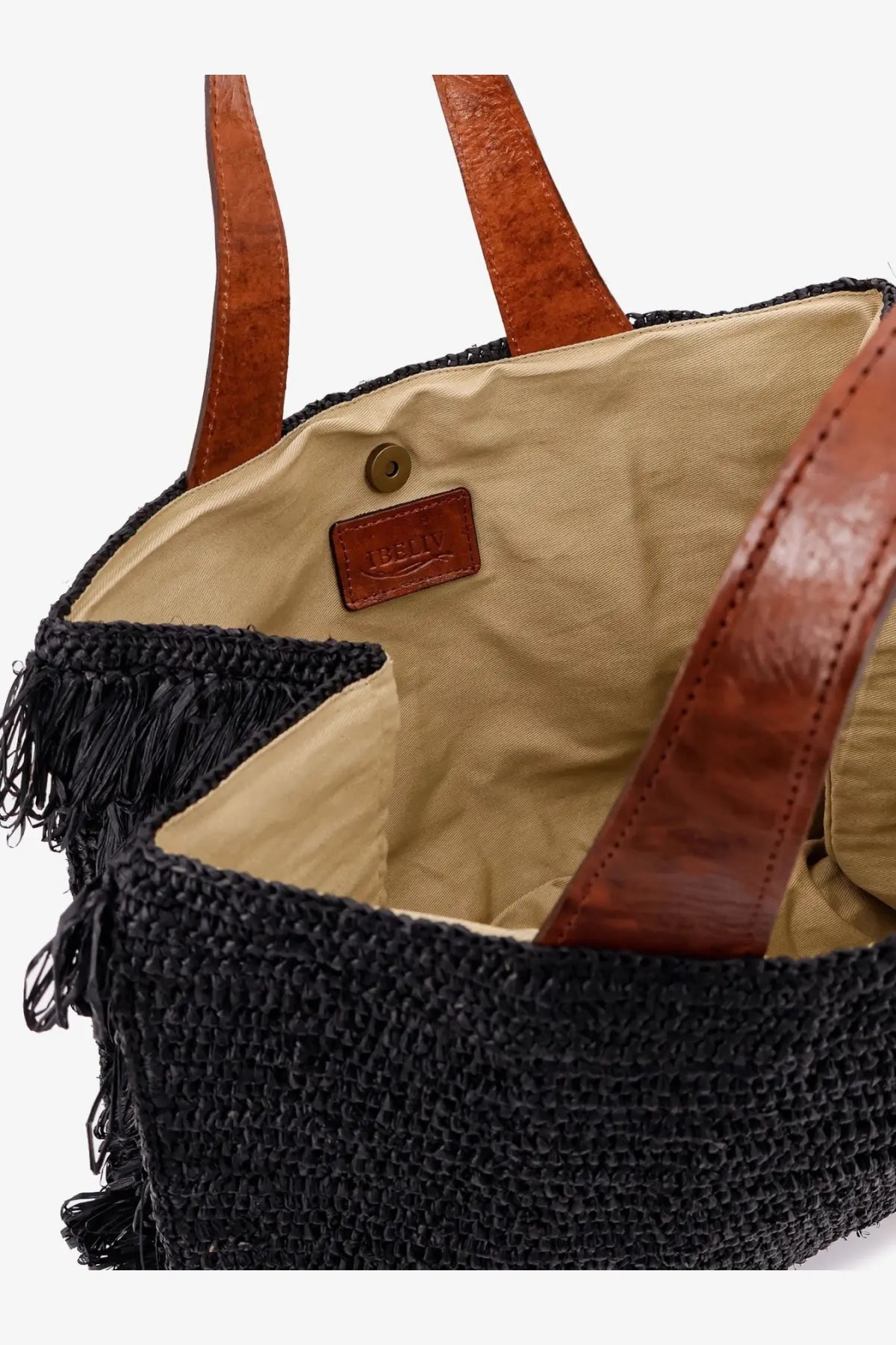 Ibeliv women’s onja raffia crossbody black woven straw tote bag with brown leather handles and tan interior lining
