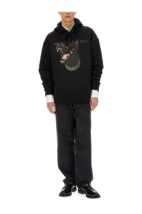 Black Ih Nom Uh Nit men’s sweatshirt with bold Dobermann dog graphic chains and pink il nov uh nit text on front