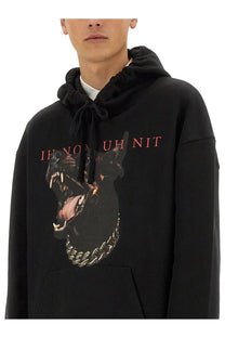 Black Ih Nom Uh Nit men’s sweatshirt with dobberman graphic wearing gold chain and red text on front