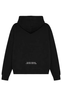 Back view of ih nom uh nit men’s black felpa con stampa hoodie with white black series limited edition text