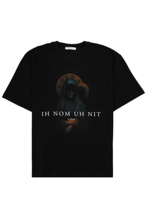 Black short-sleeved ih nom uh nit paris t-shirt featuring a dark hooded figure with an ornate halo on the chest