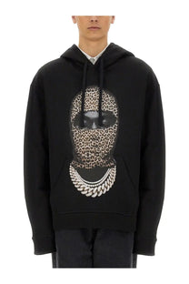 Ih nom uh nit men’s black hoodie featuring a bold leopard print face with sunglasses and silver chain necklace design