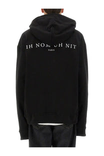 Black ih nom uh nit men’s sweatshirt with white ih nomosh nit paris lettering on the back