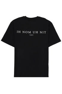 Black short-sleeved ih nom uh nit men’s t-shirt with white ih nom uh nit paris text printed on the back