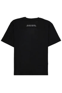 Black short-sleeved t-shirt by ih nom uh nit with black series limited edition white text on the back