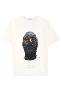 Ih nom uh nit men’s off-white cotton t-shirt with black beanie-covered face graphic and sparkling embellishments