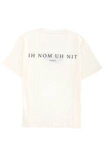 Cream-colored oversized cotton ih nom uh nit men’s t-shirt white with black text printed across the back