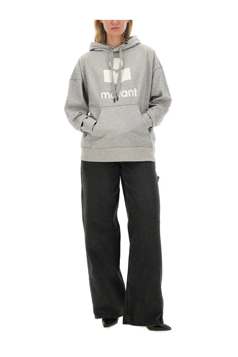 Gray hooded sweatshirt with white mavant logo printed on the chest paired with isabel marant étoile women’s jeans solene black