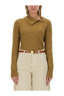 A mustard-yellow textured knit sweater with asymmetrical collar and ribbed cuffs by Isabel Marant Étoile