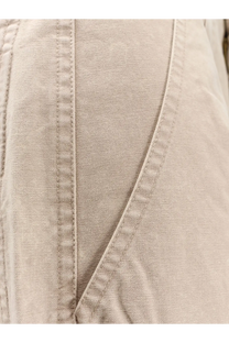Beige linen jacket with subtle vertical stitching and soft textured weave paired with isabel marant étoile white denim trousers