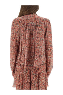 Isabel Marant Étoile women’s noeline blouse in rust-colored fabric with intricate floral pattern and long flowing sleeves