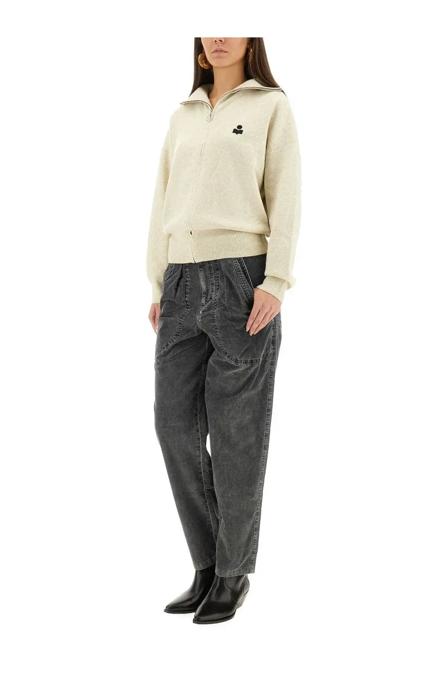 Cream-colored zip-up sweater with small black embroidered logo on left chest paired with Isabel Marant Étoile black pants